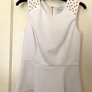 White top with gold grommets